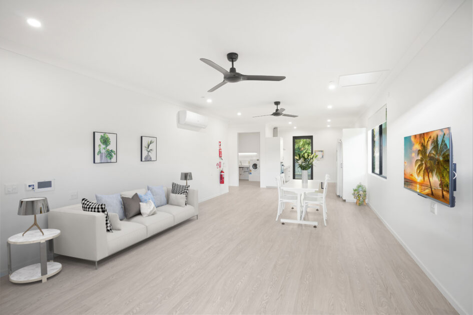 Living couch against wall under pictures 1 1