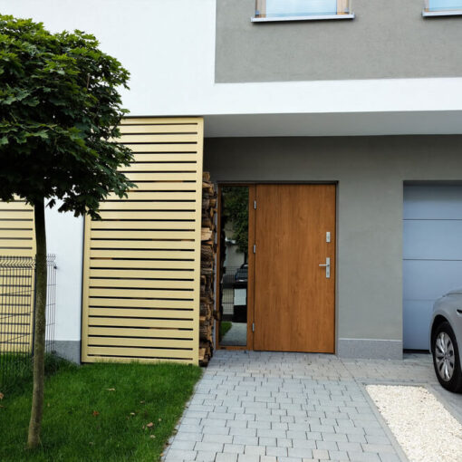 In car looking out at house