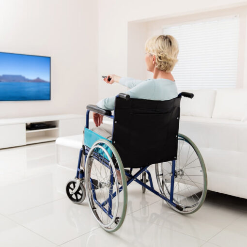 Lady in wheelchair watching TV