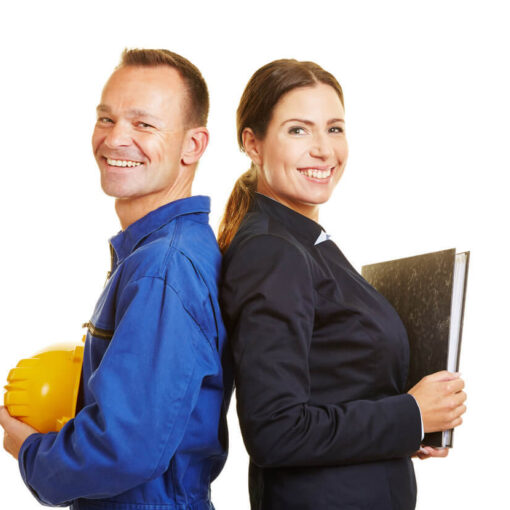 male mechanic leaning against female office employee both smiling at camera