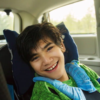Boy in car smiling