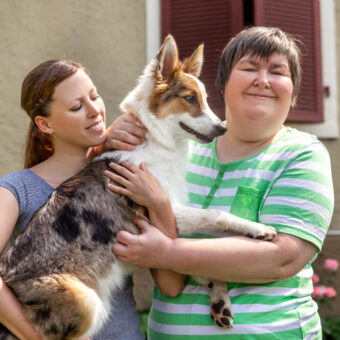 two ladies and a dog